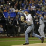 Tim McGraw throws out the ceremonial first pitch before Game 4 of the Major League Baseball World Series between the New York Mets and the Kansas City Royals Saturday, Oct. 31, 2015, in New York. (AP Photo/David J. Phillip)