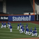 New York Mets players stretch before Game 4 of the Major League Baseball World Series between the New York Mets and the Kansas City Royals Saturday, Oct. 31, 2015, in New York. (AP Photo/Matt Slocum)