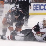 Anaheim Ducks' Jakob Silfverberg (33) and Arizona Coyotes center Antoine Vermette (50) collide during the second period of an NHL hockey game in Anaheim, Calif., Wednesday, Oct. 14, 2015. (AP Photo/Christine Cotter)