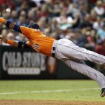 Houston Astros' Luis Valbuena dives in vain for a ball hit by Arizona Diamondbacks' Jamie Romak for a double during the third inning of a baseball game Friday, Oct. 2, 2015, in Phoenix. (AP Photo/Ross D. Franklin)