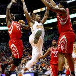 Phoenix Suns' P.J. Tucker is fouled by Houston Rockets' Joshua Smith (42) during the second half of an NBA  preseason basketball game, Tuesday, Oct. 13, 2015, in Phoenix. (AP Photo/Matt York)