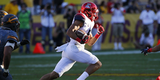 Arizona wide receiver Trey Griffey (5) runs for a touchdown during the second half of an NCAA colle...