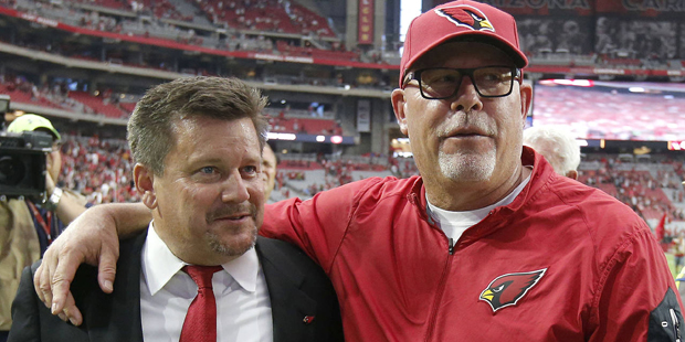 Arizona Cardinals head coach Bruce Arians, right, puts his arm around Cardinals team president Mich...