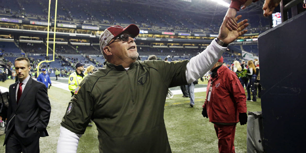 Arizona Cardinals head coach Bruce Arians leaves the field after an NFL football game against the S...
