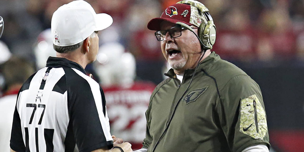 Arizona Cardinals head coach Bruce Arians talks with referee Terry McAulay (77) during the first ha...