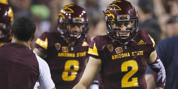 Arizona State's Mike Bercovici (2) and D.J. Foster (8) run onto the field prior to an NCAA college ...