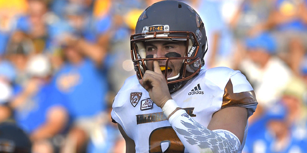 Arizona State quarterback Mike Bercovici gestures to fans after they scored a touchdown during the ...