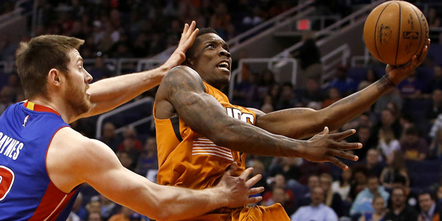 Phoenix Suns guard Eric Bledsoe, right, drives past Detroit Pistons forward Aron Baynes during the ...