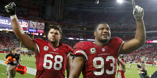 Arizona Cardinals' Calais Campbell (93) and Jared Veldheer (68) celebrate as they walk off the fiel...