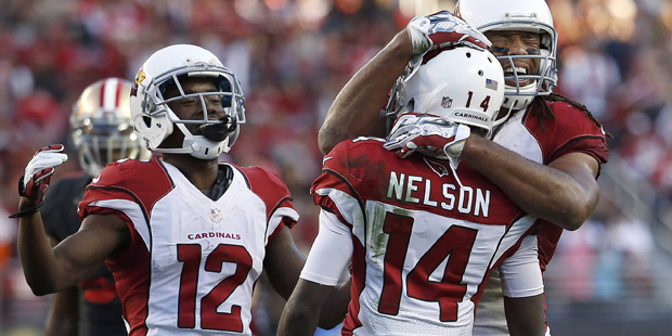 Arizona Cardinals wide receiver J.J. Nelson (14) is congratulated by John Brown (12) and Larry Fitz...
