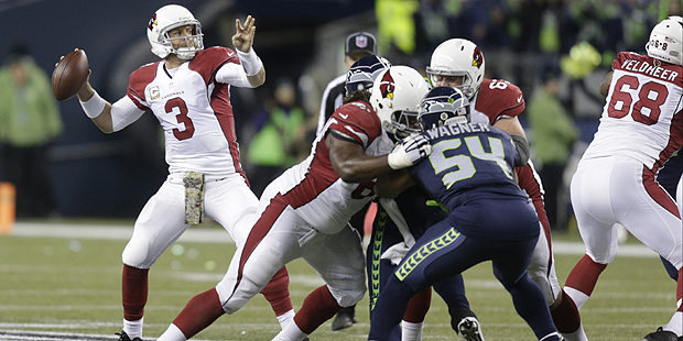 Arizona Cardinals quarterback Carson Palmer (3) passes against the Seattle Seahawks in the first ha...