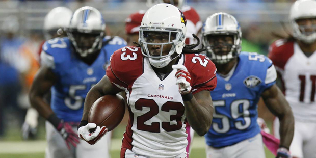 Arizona Cardinals running back Chris Johnson (23) is chased by the Detroit Lions defense during the...