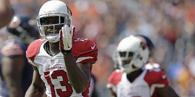 Arizona Cardinals wide receiver Jaron Brown (13) celebrates a touchdown during the first half of an...