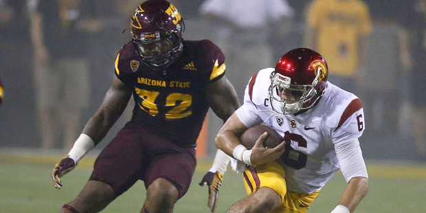 Southern California's Cody Kessler (6) dives for a first down as he gets past Arizona State's Anton...