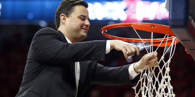 Arizona head coach Sean Miller cuts down part of the net after defeating Stanford 91-69 and winning...