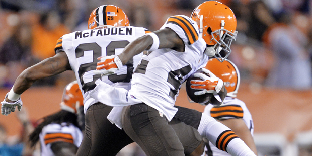 Cleveland Browns defensive back Robert Nelson (42) celebrates with Leon McFadden (29) after an inte...