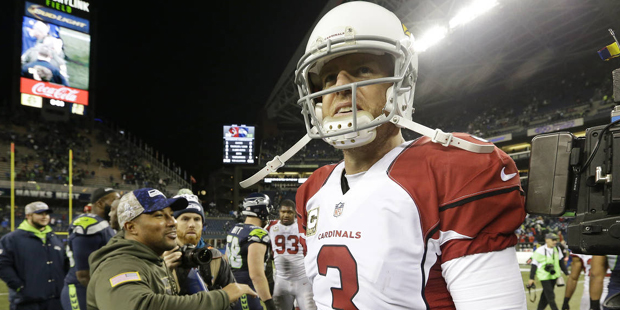 Arizona Cardinals quarterback Carson Palmer leaves the field after an NFL football game against the...