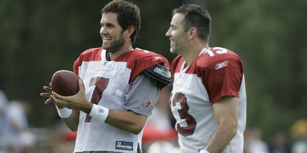 Arizona Cardinals quarterback Kurt Warner, and Matt Leinart share a laugh during an NFL football tr...