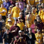 
              Arizona State and Washington fans pause during a moment of silence to honor those who died during the Paris terrorist attacks prior to an NCAA college football game between Arizona State and Washington, Saturday, Nov. 14, 2015, in Tempe, Ariz. (AP Photo/Ross D. Franklin)
            