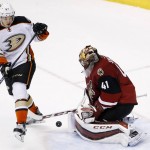 Arizona Coyotes' Mike Smith (41) makes a save on a shot as Anaheim Ducks' Rickard Rakell (67), of Sweden, creates a screen in front during the second period of an NHL hockey game Wednesday, Nov. 25, 2015, in Glendale, Ariz. (AP Photo/Ross D. Franklin)