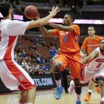 Boise State guard Montigo Alford, center, passes the ball as he is defended by Arizona forward Mark Tollefsen, left, and Gabe York during the first half of an NCAA college basketball game at the Wooden Legacy tournament, Sunday, Nov. 29, 2015, in Anaheim, Calif. (AP Photo/Jae C. Hong)