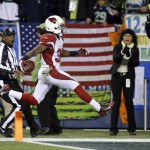 Arizona Cardinals running back Andre Ellington leaps into the end zone for a touchdown against the Seattle Seahawks during the second half of an NFL football game, Sunday, Nov. 15, 2015, in Seattle. (AP Photo/Elaine Thompson)
