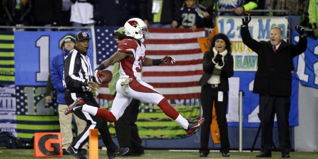 Arizona Cardinals running back Andre Ellington leaps into the end zone for a touchdown against the ...