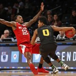 North Carolina State guard Anthony Barber (12) tries to avoid drawing a foul as Arizona State guard Tra Holder (0) drives down court in the second half of a Legends Classic semifinal in an NCAA college basketball game Monday, Nov. 23, 2015, in New York. Arizona State defeated North Carolina State 79-76. (AP Photo/Kathy Willens)