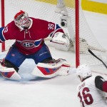 Arizona Coyotes' Max Domi takes a shot on Montreal Canadiens goaltender Mike Condon during the third period of an NHL hockey game in Montreal, Thursday, Nov. 19, 2015. (Graham Hughes/The Canadian Press via AP) MANDATORY CREDIT