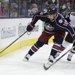 Columbus Blue Jackets' Rene Bourque, left, tries to keep the puck away from Arizona Coyotes' Stefan Elliott during the second period of an NHL hockey game, Saturday, Nov. 14, 2015, in Columbus, Ohio. (AP Photo/Jay LaPrete)
