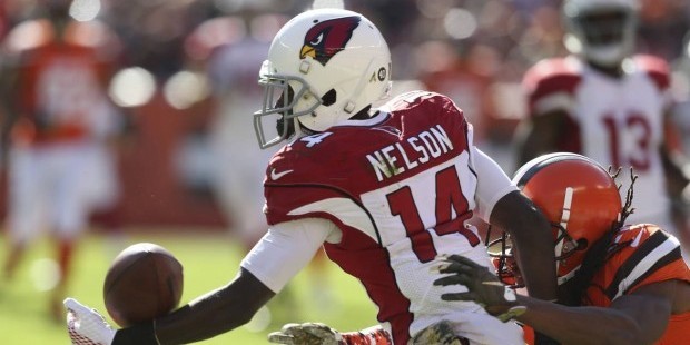 Arizona Cardinals wide receiver J.J. Nelson, left, makes a one-handed catch against Cleveland Brown...