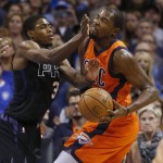 Oklahoma City Thunder forward Kevin Durant, right, is fouled by Phoenix Suns guard Brandon Knight (3) in the first quarter of an NBA basketball game in Oklahoma City, Sunday, Nov. 8, 2015. (AP Photo/Sue Ogrocki)