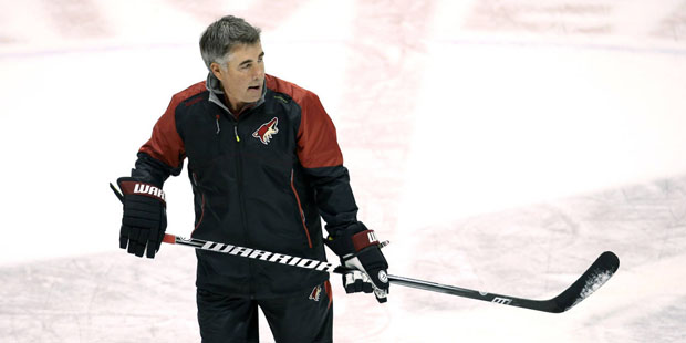 Arizona Coyotes coach Dave Tippett skates around with players during the first full day of NHL hock...