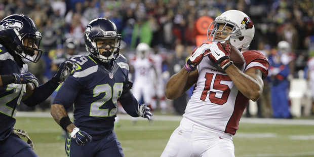 Arizona Cardinals wide receiver Michael Floyd (15) makes a catch as Seattle Seahawks free safety Ea...