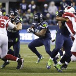 Seattle Seahawks running back Marshawn Lynch (24) runs against the Arizona Cardinals during the first half of an NFL football game, Sunday, Nov. 15, 2015, in Seattle. (AP Photo/Elaine Thompson)