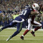Seattle Seahawks outside linebacker Bruce Irvin (51) breaks up a pass intended for Arizona Cardinals running back Chris Johnson in the first half of an NFL football game, Sunday, Nov. 15, 2015, in Seattle. (AP Photo/Elaine Thompson)