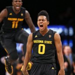 Arizona State guard Tra Holder (0) and forward Savon Goodman (11) react after a basket in the second half of an NCAA college basketball game in the Legends Classic semifinal against North Carolina State, Monday, Nov. 23, 2015, in New York.  Arizona State defeated North Carolina State 79-76. (AP Photo/Kathy Willens)