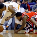 Phoenix Suns guard Eric Bledsoe (2) and Chicago Bulls guard Aaron Brooks (0) battle for a lose ball during the second half of an NBA basketball game Wednesday, Nov. 18, 2015, in Phoenix. (AP Photo/Matt York)