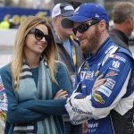 Sprint Cup Series driver Dale Earnhardt Jr. (88) talks with his fiance, Amy Reimann, prior to the Sprint Cup auto race at Martinsville Speedway in Martinsville, Va., Sunday, Nov. 1, 2015. (AP Photo/Steve Helber)