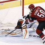 Arizona Coyotes' Antoine Vermette (50) scores a goal against Anaheim Ducks' John Gibson, left, as Ducks' Kevin Bieksa (2) looks on during the second period of an NHL hockey game Wednesday, Nov. 25, 2015, in Glendale, Ariz. (AP Photo/Ross D. Franklin)