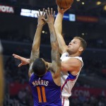 Los Angeles Clippers forward Blake Griffin, right, shoots as Phoenix Suns forward Markieff Morris defends during the first half of an NBA basketball game Monday, Nov. 2, 2015, in Los Angeles. (AP Photo/Mark J. Terrill)