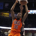 Oklahoma City Thunder forward Kevin Durant (35) dunks in front of Phoenix Suns forward T.J. Warren (12) in the second quarter of an NBA basketball game in Oklahoma City, Sunday, Nov. 8, 2015. (AP Photo/Sue Ogrocki)