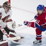 Arizona Coyotes goaltender Mike Smith makes a save against Montreal Canadiens' David Desharnais during the third period of an NHL hockey game in Montreal, Thursday, Nov. 19, 2015. (Graham Hughes/The Canadian Press via AP) MANDATORY CREDIT
