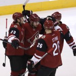 Arizona Coyotes left wing Mikkel Boedker (89) celebrates with teammates after scoring in the first period during an NHL hockey game against the Ottawa Senators, Saturday, Nov. 28, 2015, in Glendale, Ariz. (AP Photo/Rick Scuteri)