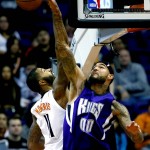 Sacramento Kings' Willie Cauley-Stein (00) blocks the shot of Phoenix Suns' Markieff Morris during the first half of an NBA basketball game, Wednesday, Nov. 4, 2015, in Phoenix. (AP Photo/Matt York)