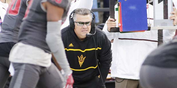 Arizona State head coach Todd Graham watches from the sideline during the first half of an NCAA col...
