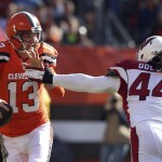 Cleveland Browns quarterback Josh McCown (13) scrabbles away from Arizona Cardinals outside linebacker Markus Golden (44) in the first half of an NFL football game, Sunday, Nov. 1, 2015, in Cleveland. (AP Photo/Ron Schwane)