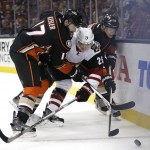 Arizona Coyotes' Michael Stone, center, is defended by Anaheim Ducks' Ryan Kesler, Jakob Silfverberg, of Sweden, during the second period of an NHL hockey game, Monday, Nov. 9, 2015, in Anaheim, Calif. (AP Photo/Jae C. Hong)