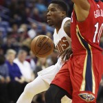 Phoenix Suns guard Eric Bledsoe, left, moves the ball past New Orleans Pelicans guard Eric Gordon in the first half of an NBA basketball game in New Orleans, Sunday, Nov. 22, 2015. (AP Photo/Max Becherer)