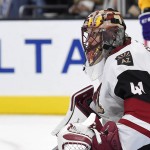 Arizona Coyotes goalie Mike Smith watches the puck fly in front of him during the second period of an NHL hockey game against the Los Angeles Kings, Tuesday, Nov. 10, 2015, in Los Angeles. (AP Photo/Mark J. Terrill)
